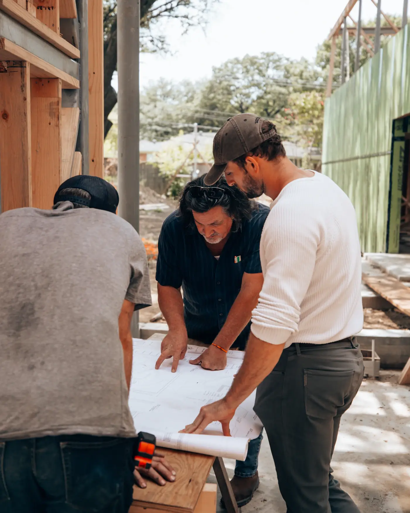 Property improvement team reviewing plans together