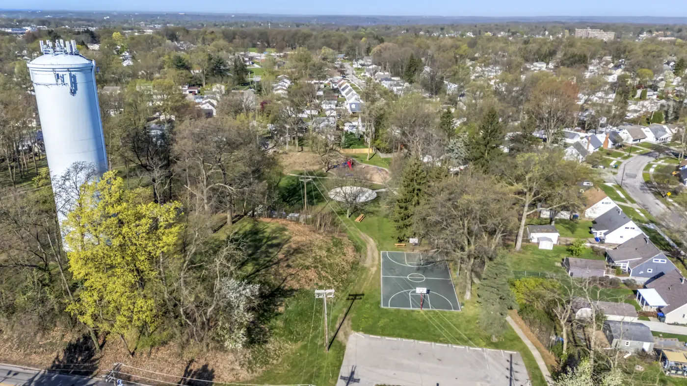 Aerial view of a suburban neighborhood with water tower