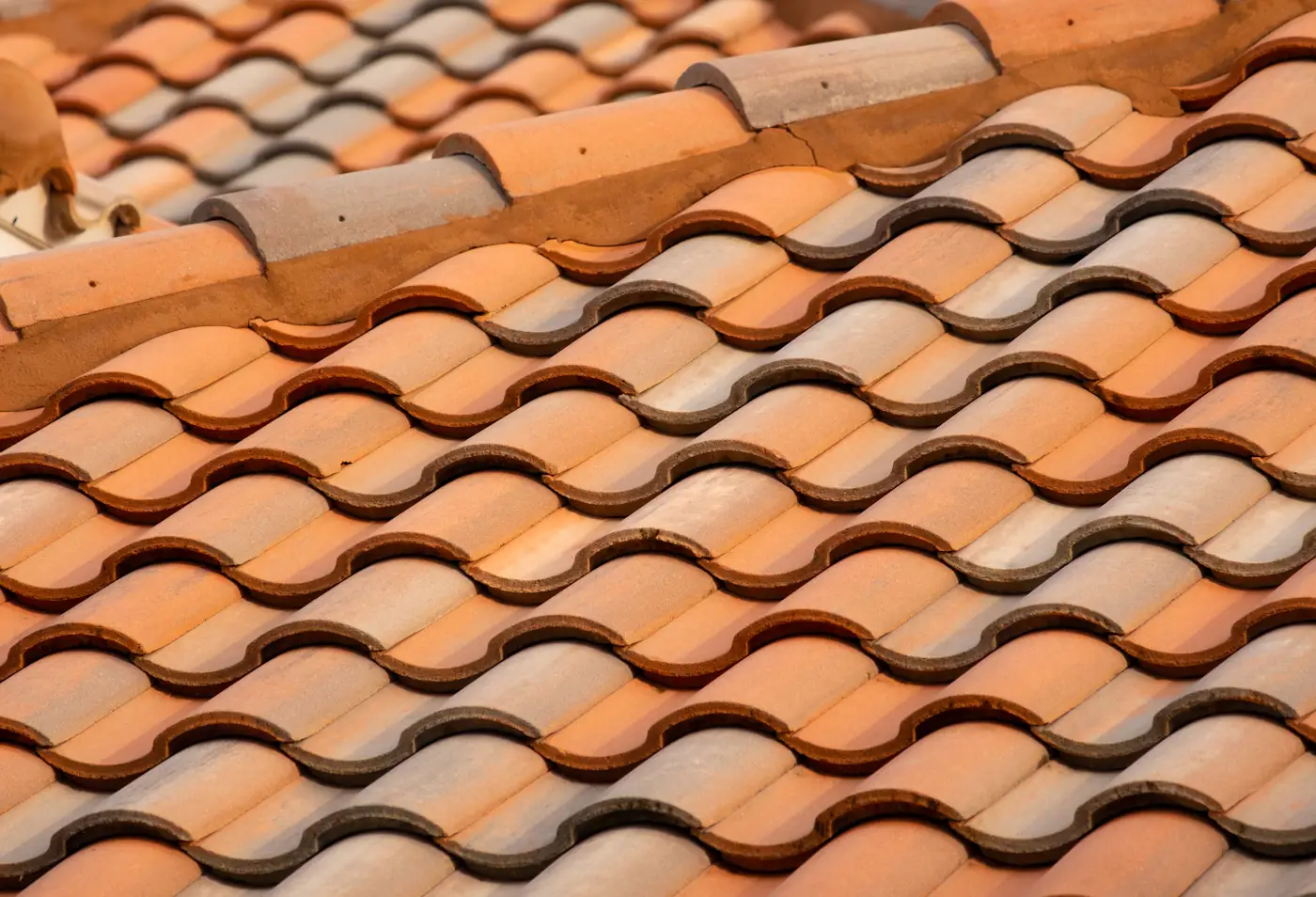 Close-up of brown roof tiles staged for a roofing project